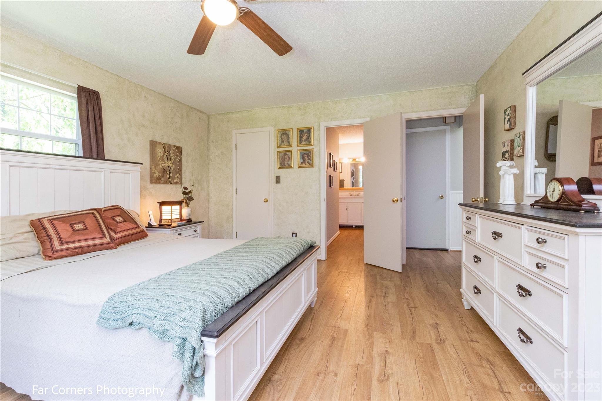 1454 Sorrells Cove Road Clyde, NC 28721 - Photo 20 of 26 a spacious bedroom with a bed and a dresser