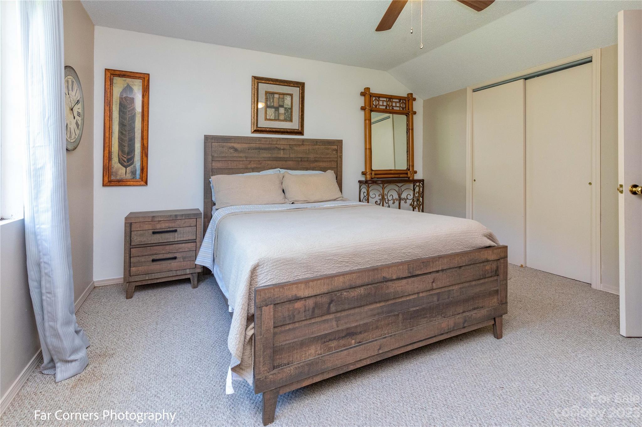 1454 Sorrells Cove Road Clyde, NC 28721 - Photo 22 of 26 a bedroom with a bed and a cabinets