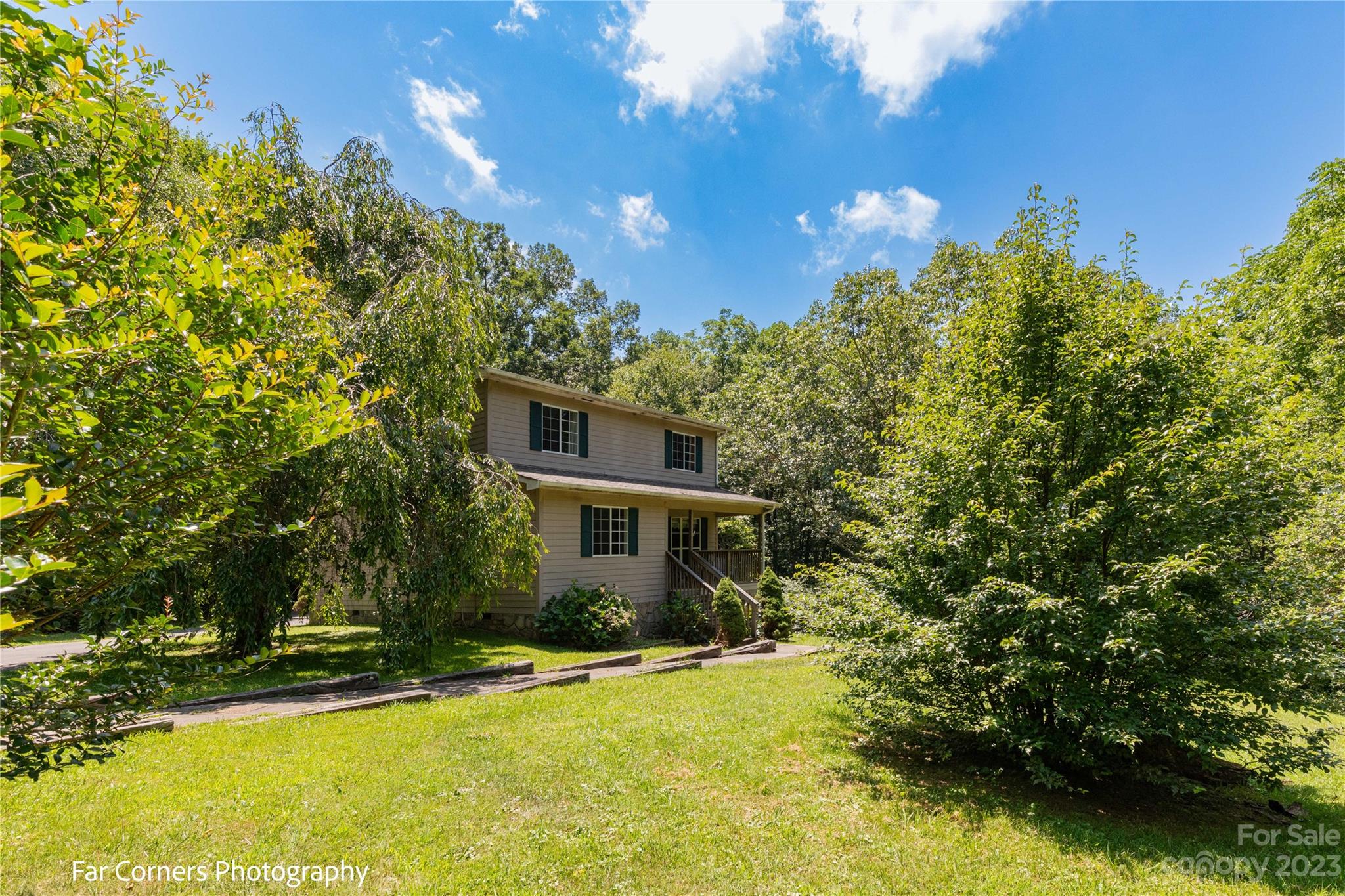 1454 Sorrells Cove Road Clyde, NC 28721 - Photo 3 of 26 a front view of a house with a yard