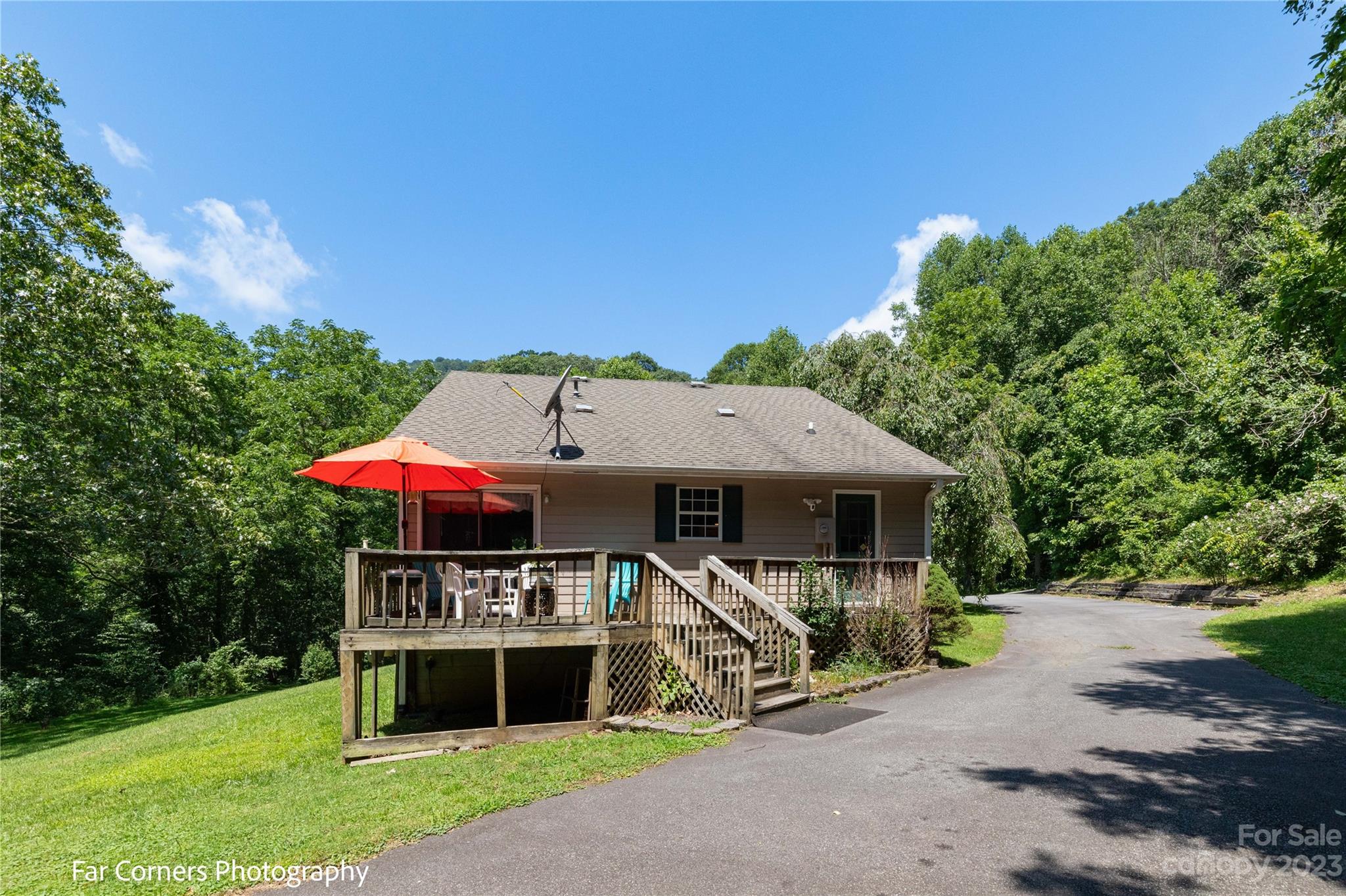 1454 Sorrells Cove Road Clyde, NC 28721 - Photo 7 of 26 a view of a house with backyard porch and sitting area