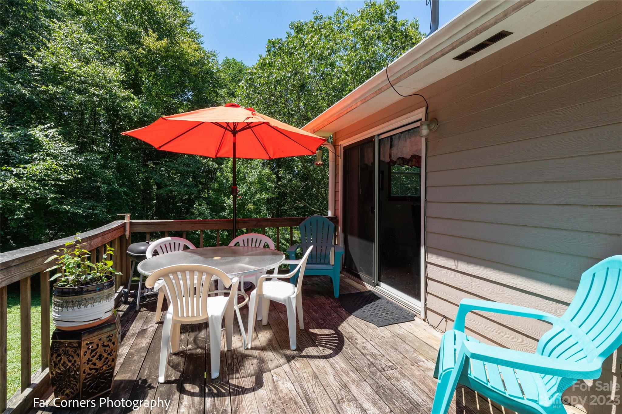 1454 Sorrells Cove Road Clyde, NC 28721 - Photo 8 of 26 a view of balcony with furniture and umbrella