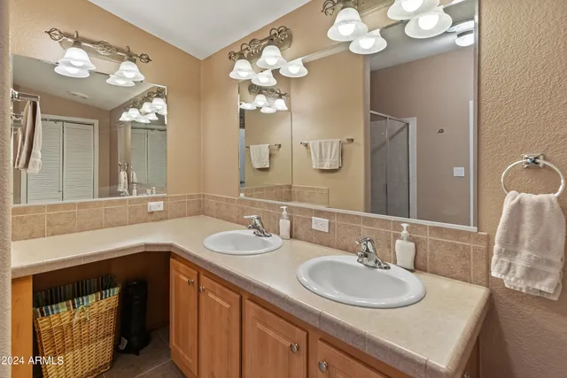 a bedroom with a bed and a table in it