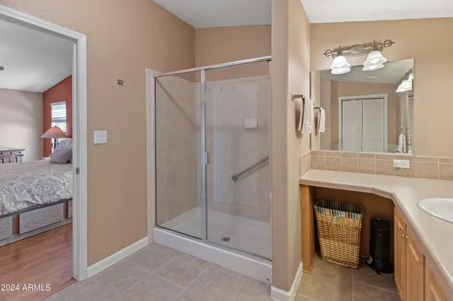 a bedroom with bed and a window