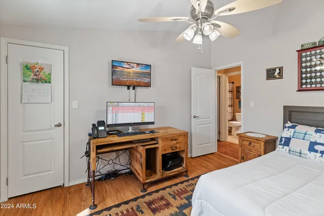 a bedroom with a bed dresser and a window