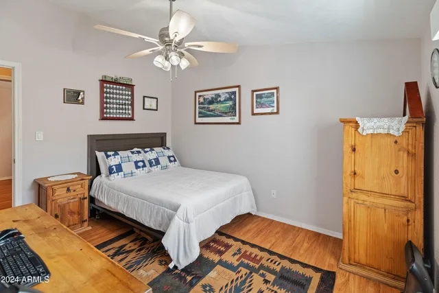 a bathroom with a sink mirror vanity and toilet