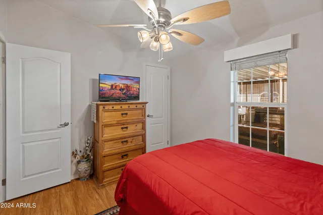 a view of a chair and table in backyard of the house