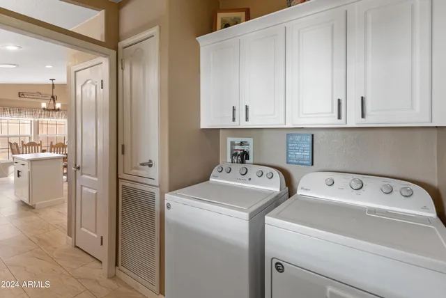 a view of a dining room with furniture and window