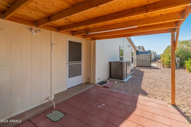 an aerial view of residential houses with outdoor space and swimming pool