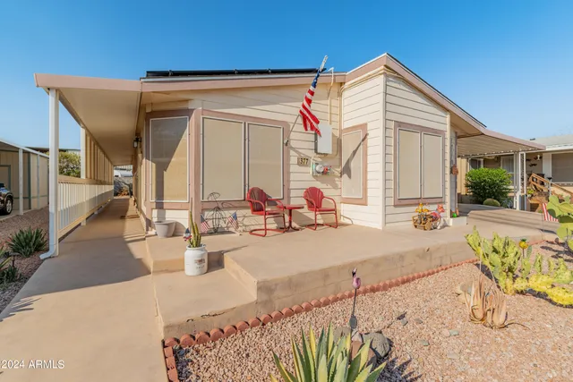 a view of a house with backyard