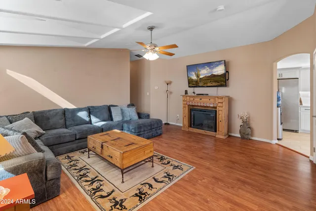 a living room with furniture and a large window