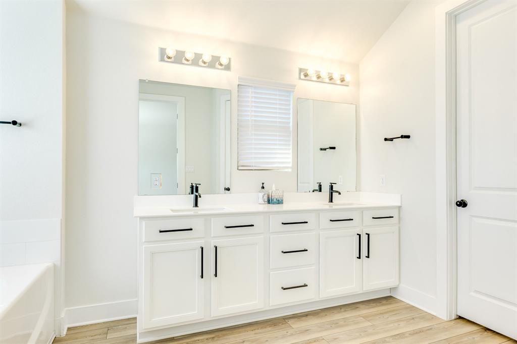 122 Biscayne Bay Bend Kyle, TX 78640 - Photo 15 of 29 a bathroom with a double vanity sink mirror and