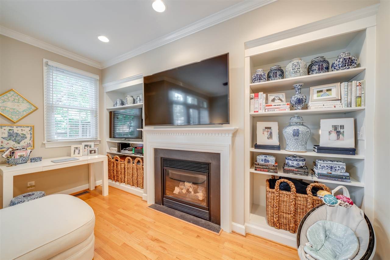 129 Fenner Lane Raleigh, NC 27603 - Photo 7 of 13 Beautiful built-in shelving in family room add to the character of this home Family Room