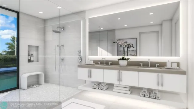 a bathroom with a double vanity sink mirror and shower