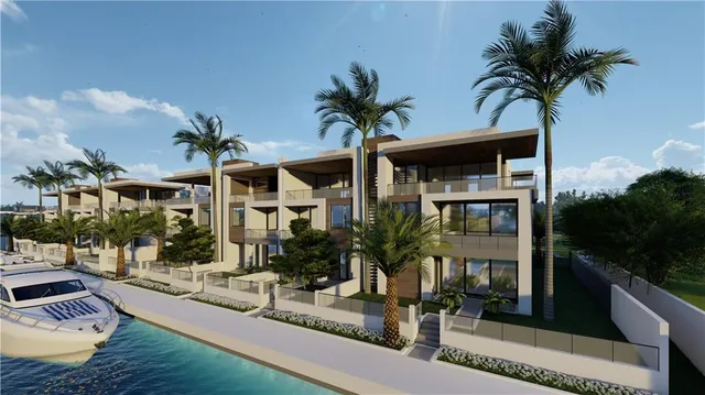 a view of multiple house with palm trees