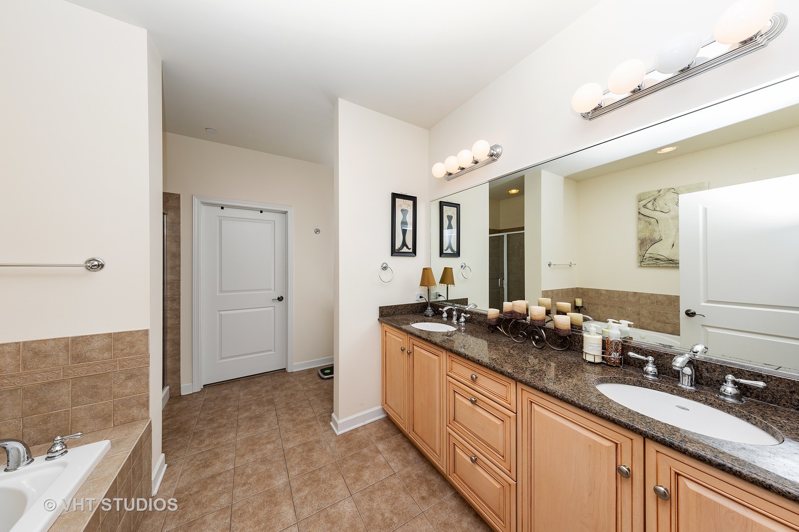 151 West Wing Street, Unit 506 Arlington Heights, IL 60005 - Photo 11 of 13 a spacious bathroom with a granite countertop sink and a mirror