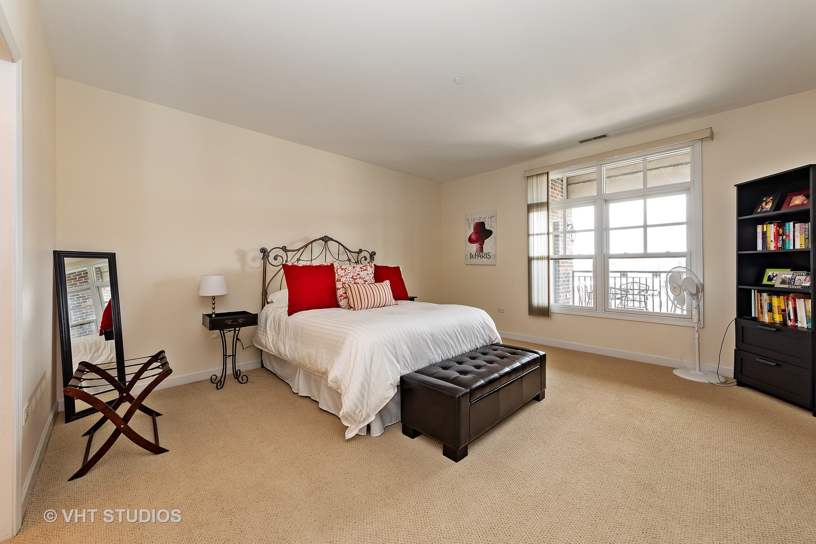 151 West Wing Street, Unit 506 Arlington Heights, IL 60005 - Photo 12 of 13 a bed sitting in a bedroom next to a window