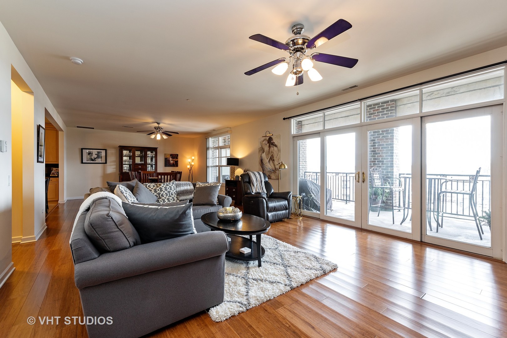 151 West Wing Street, Unit 506 Arlington Heights, IL 60005 - Photo 4 of 13 a living room with furniture large window and wooden floor