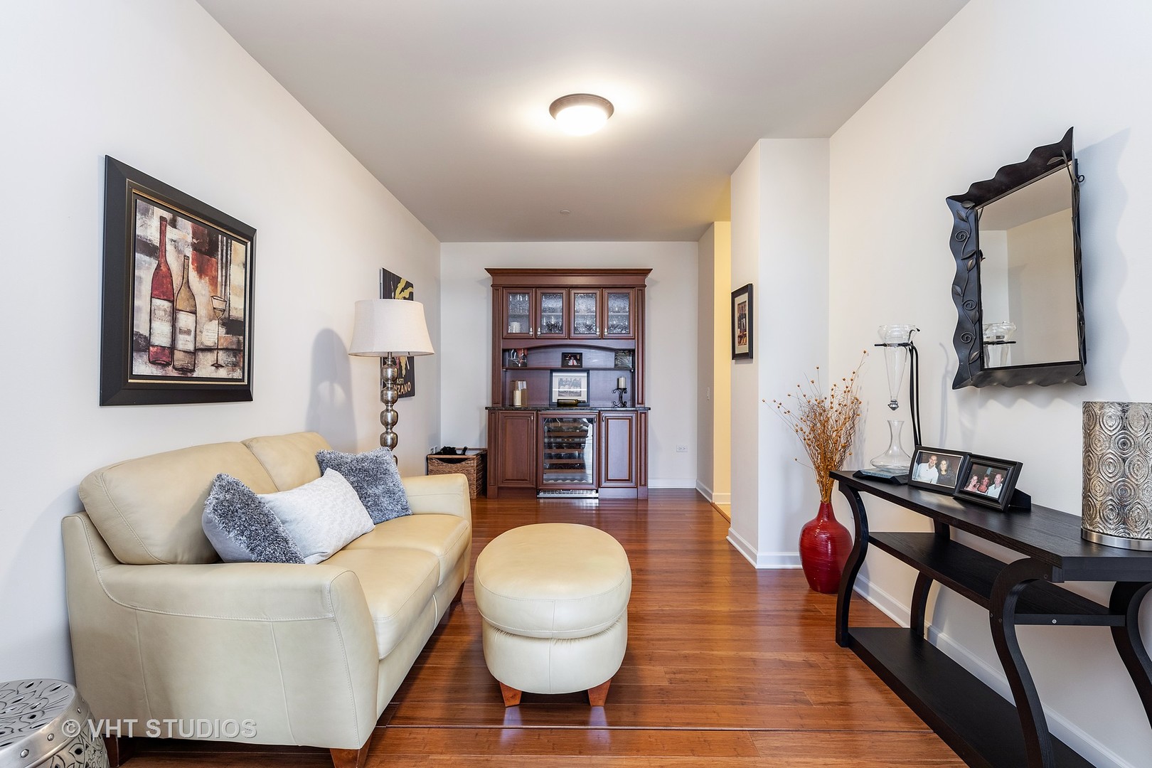 151 West Wing Street, Unit 506 Arlington Heights, IL 60005 - Photo 7 of 13 a living room with furniture and a wooden floor