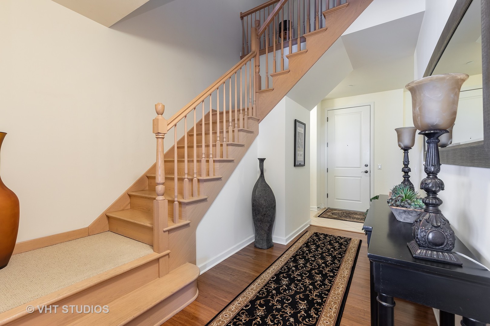 151 West Wing Street, Unit 506 Arlington Heights, IL 60005 - Photo 8 of 13 a view of entryway and hall with wooden floor