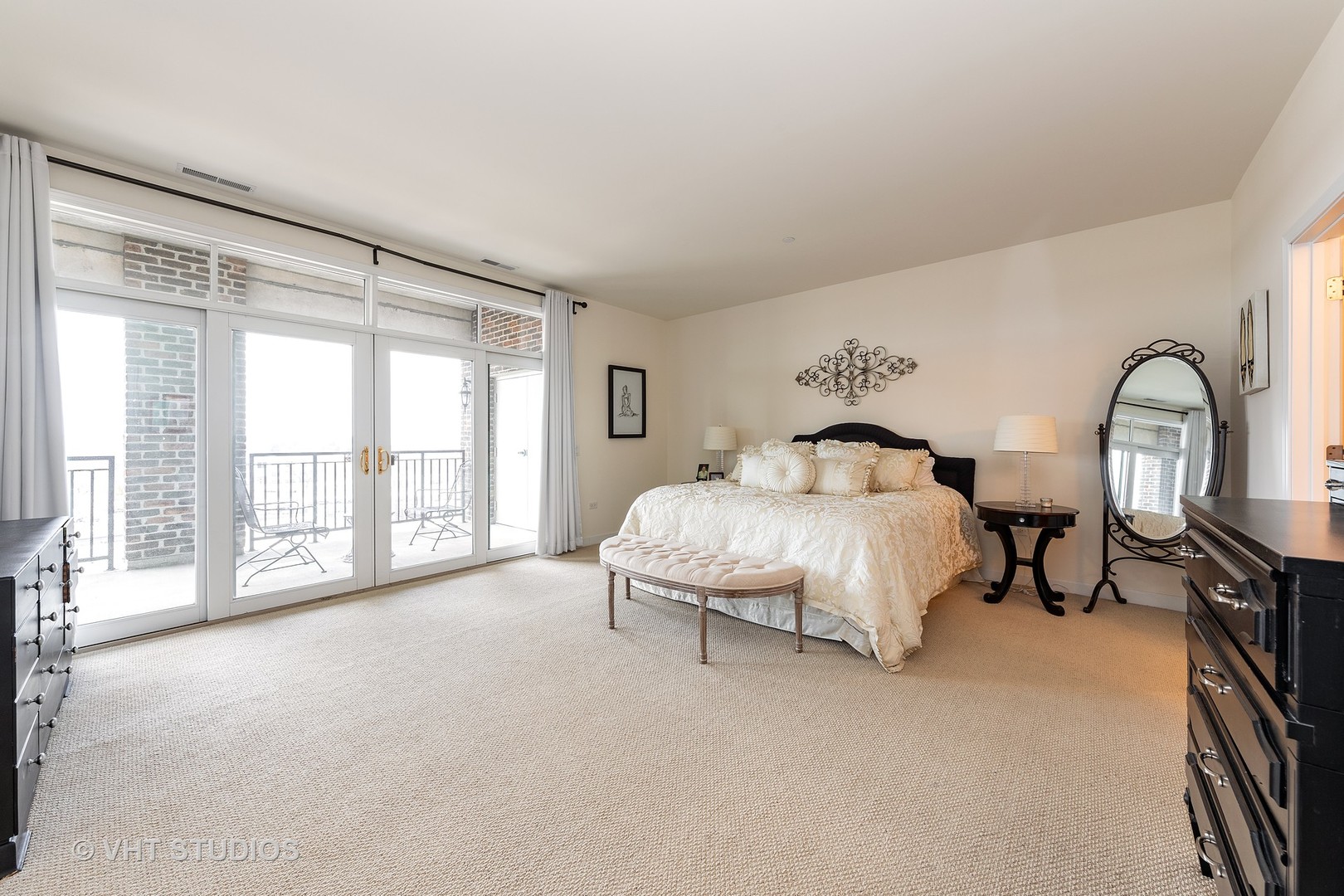 151 West Wing Street, Unit 506 Arlington Heights, IL 60005 - Photo 10 of 13 a spacious bedroom with a bed and a large window