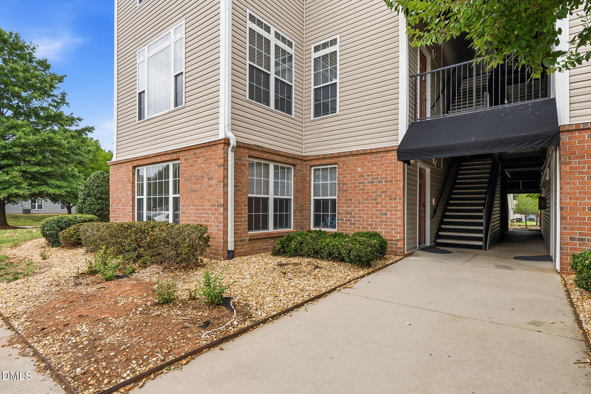 2501 Huntscroft Lane, Unit 100 Raleigh, NC 27617 - Photo 7 of 31 a front view of a house with garden