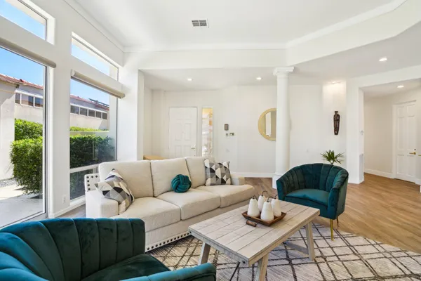 a living room with furniture and a large window