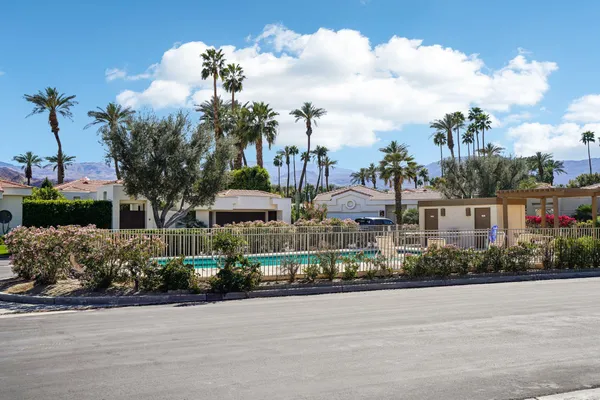 a view of a town with palm trees