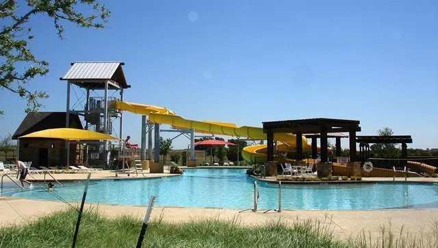a view of swimming pool with outdoor seating yard and barbeque oven