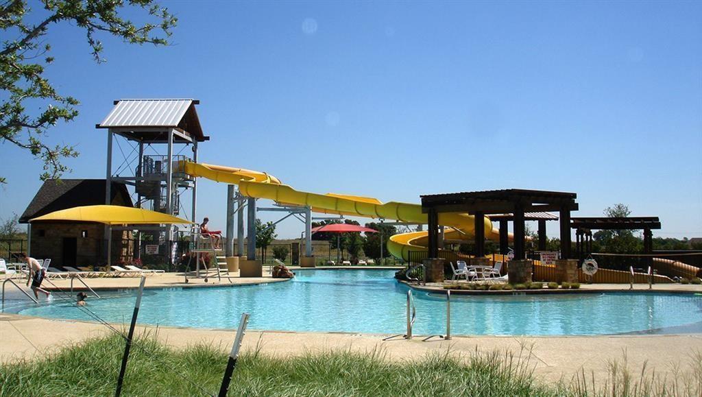 a view of swimming pool with outdoor seating yard and barbeque oven