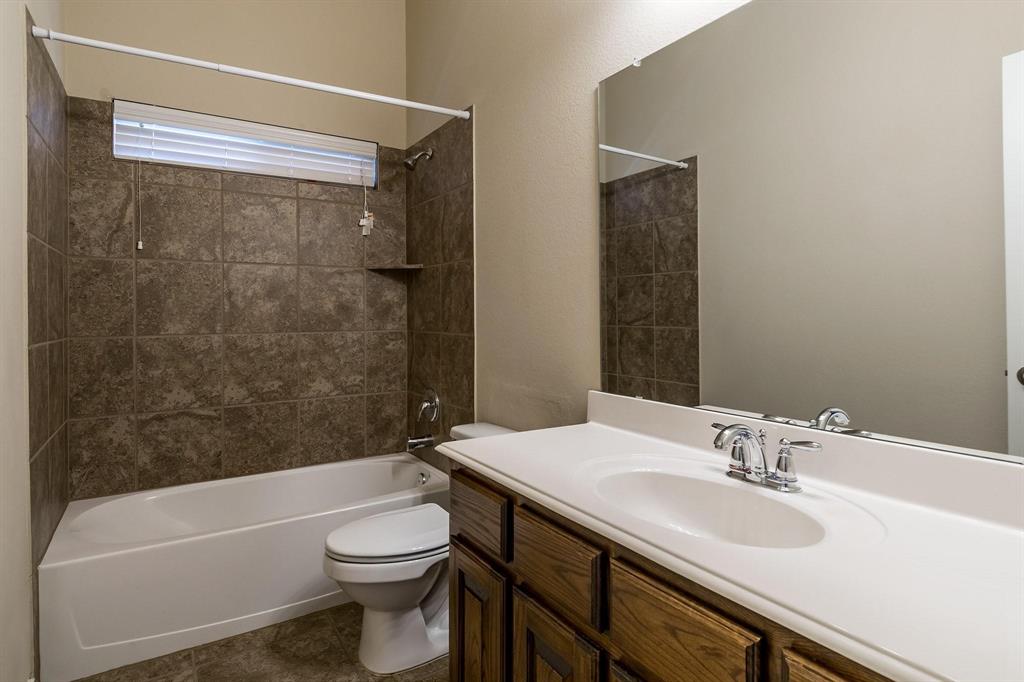 10104 Waterstone Way McKinney, TX 75072 - Photo 14 of 29 a bathroom with a sink a toilet and a bathtub