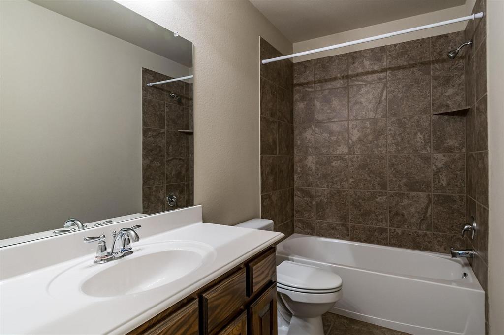 10104 Waterstone Way McKinney, TX 75072 - Photo 16 of 29 a bathroom with a sink a toilet and shower