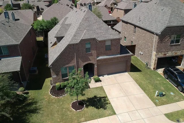 an aerial view of house with yard