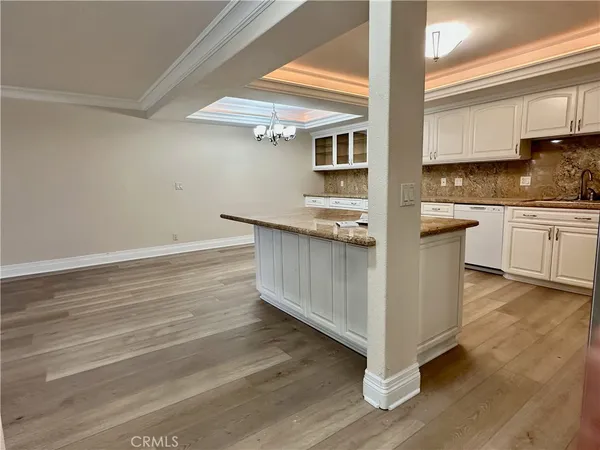 a kitchen with stainless steel appliances granite countertop a stove and cabinets