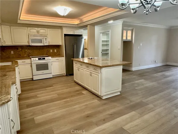 a view of a kitchen with cabinets