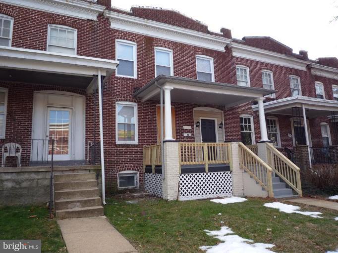 3905 Bonner Road Baltimore, MD 21216 - Photo 1 of 17 a front view of a house with a garden