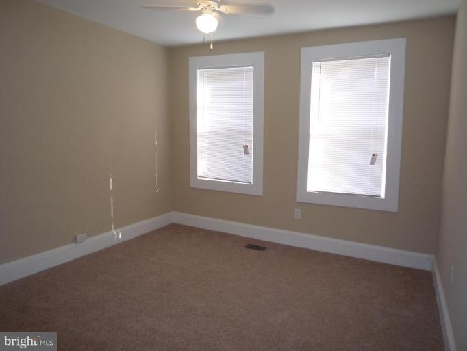 3905 Bonner Road Baltimore, MD 21216 - Photo 12 of 17 an empty room with a window