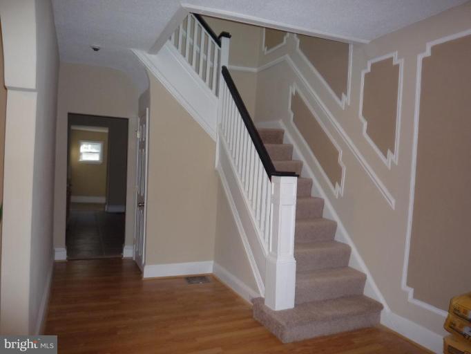 3905 Bonner Road Baltimore, MD 21216 - Photo 16 of 17 a view of entryway and hall with wooden floor