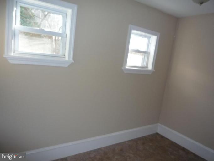 3905 Bonner Road Baltimore, MD 21216 - Photo 4 of 17 an empty room with a window