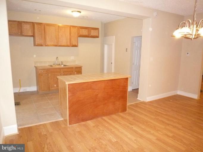 3905 Bonner Road Baltimore, MD 21216 - Photo 5 of 17 a view of a kitchen with a sink