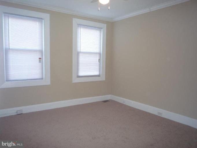 3905 Bonner Road Baltimore, MD 21216 - Photo 10 of 17 an empty room with a window