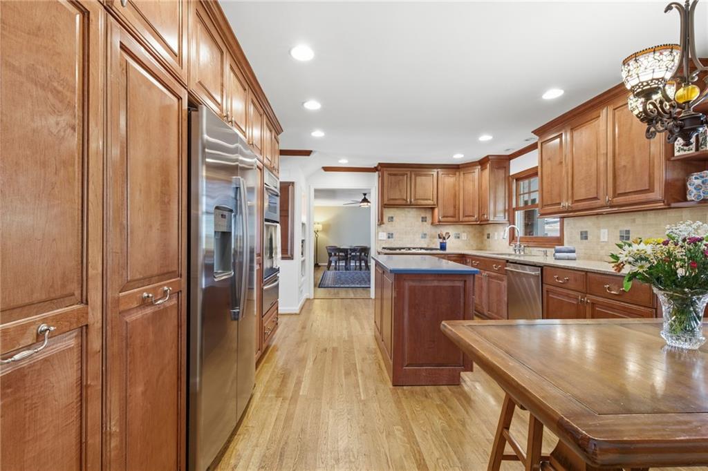 1924 Queens Way Atlanta, GA 30341 - Photo 17 of 88 a kitchen with stainless steel appliances granite countertop a refrigerator a sink and a stove
