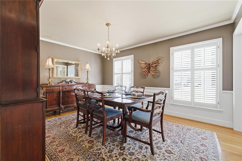 1924 Queens Way Atlanta, GA 30341 - Photo 22 of 88 a view of a dining room with furniture and chandelier