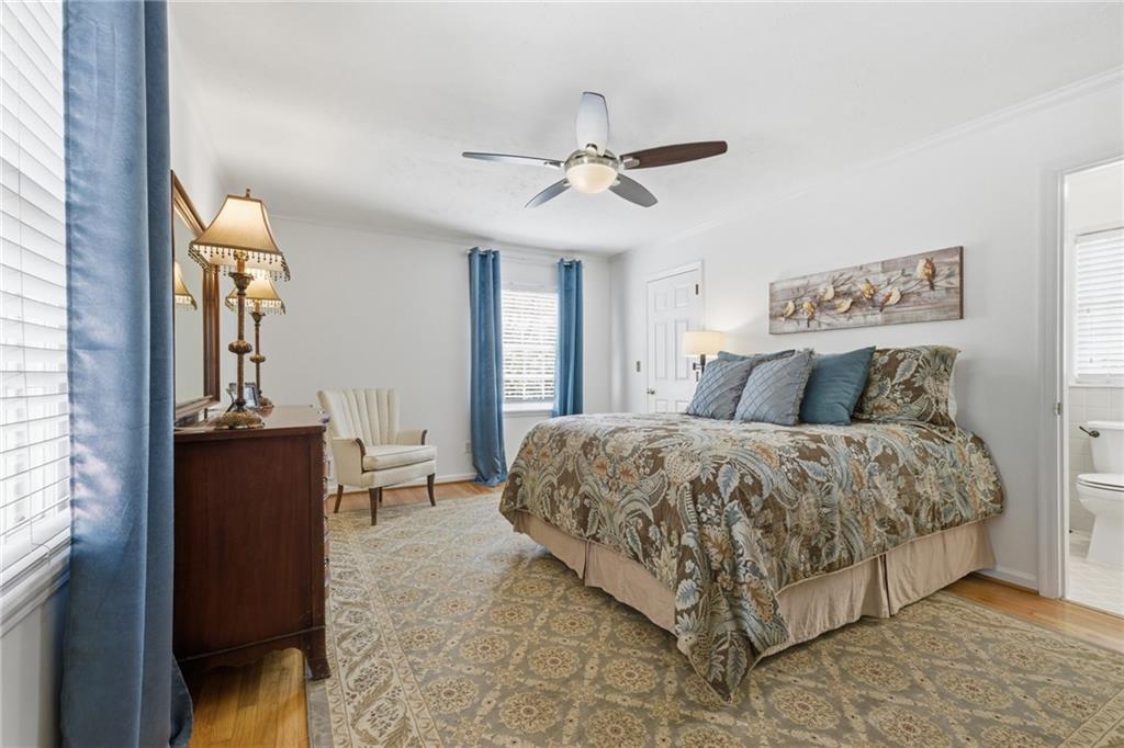 1924 Queens Way Atlanta, GA 30341 - Photo 35 of 88 a bedroom with a bed and a chandelier