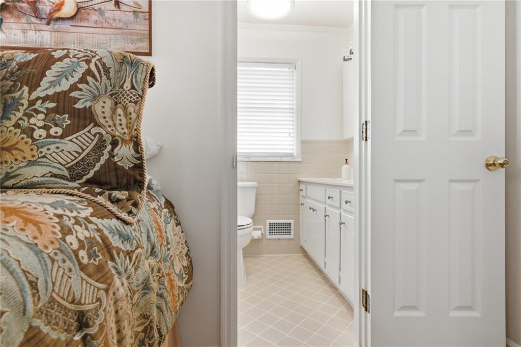 1924 Queens Way Atlanta, GA 30341 - Photo 36 of 88 a bathroom with a bathtub and a shower
