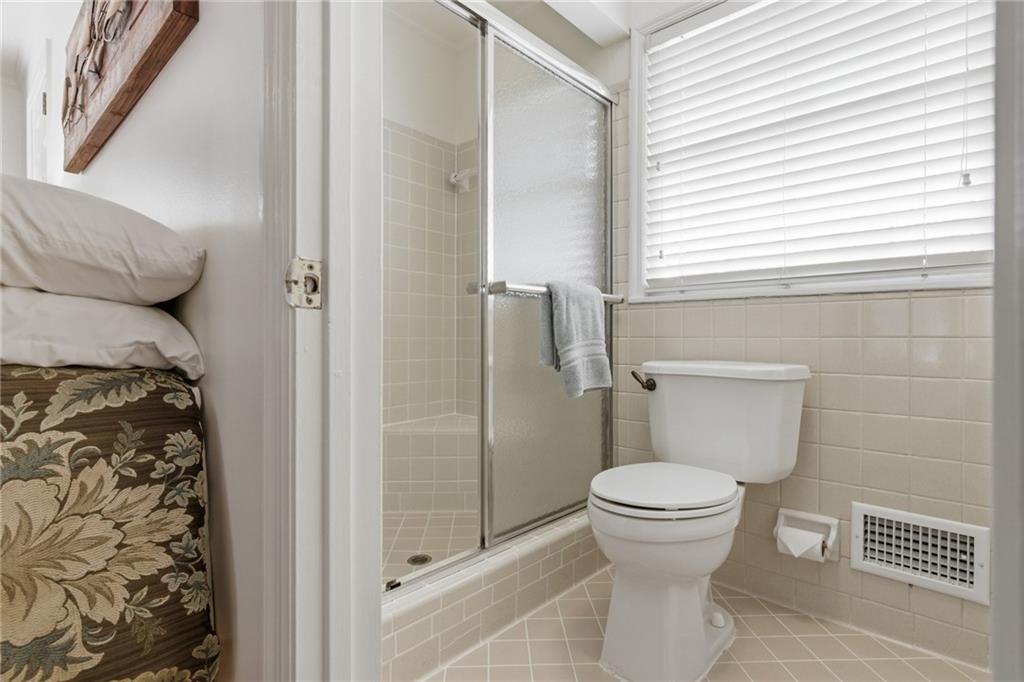 1924 Queens Way Atlanta, GA 30341 - Photo 37 of 88 a bathroom with a toilet and a shower