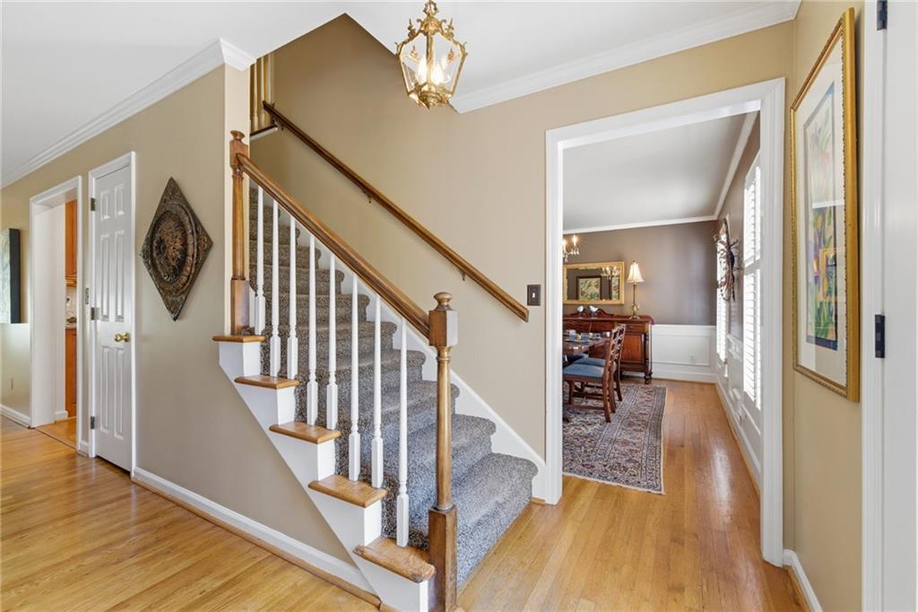 1924 Queens Way Atlanta, GA 30341 - Photo 39 of 88 a view of a hallway with wooden floor and staircase