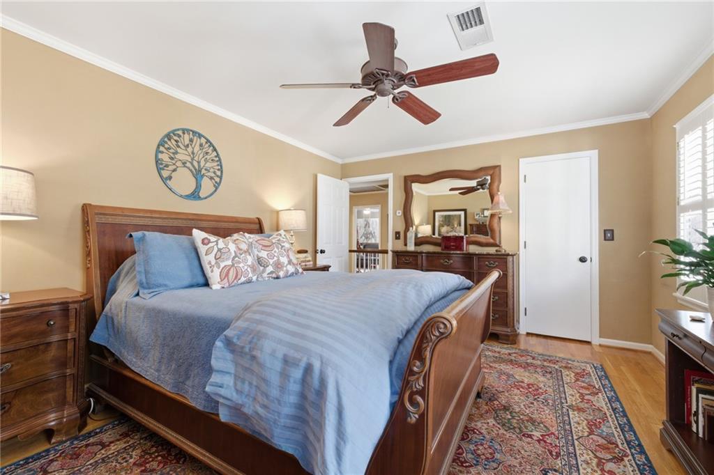 1924 Queens Way Atlanta, GA 30341 - Photo 47 of 88 a bed room with a bed and a chandelier