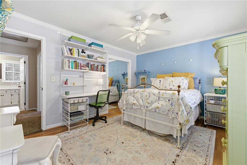 1924 Queens Way Atlanta, GA 30341 - Photo 52 of 88 a bedroom with a bed a table and painting