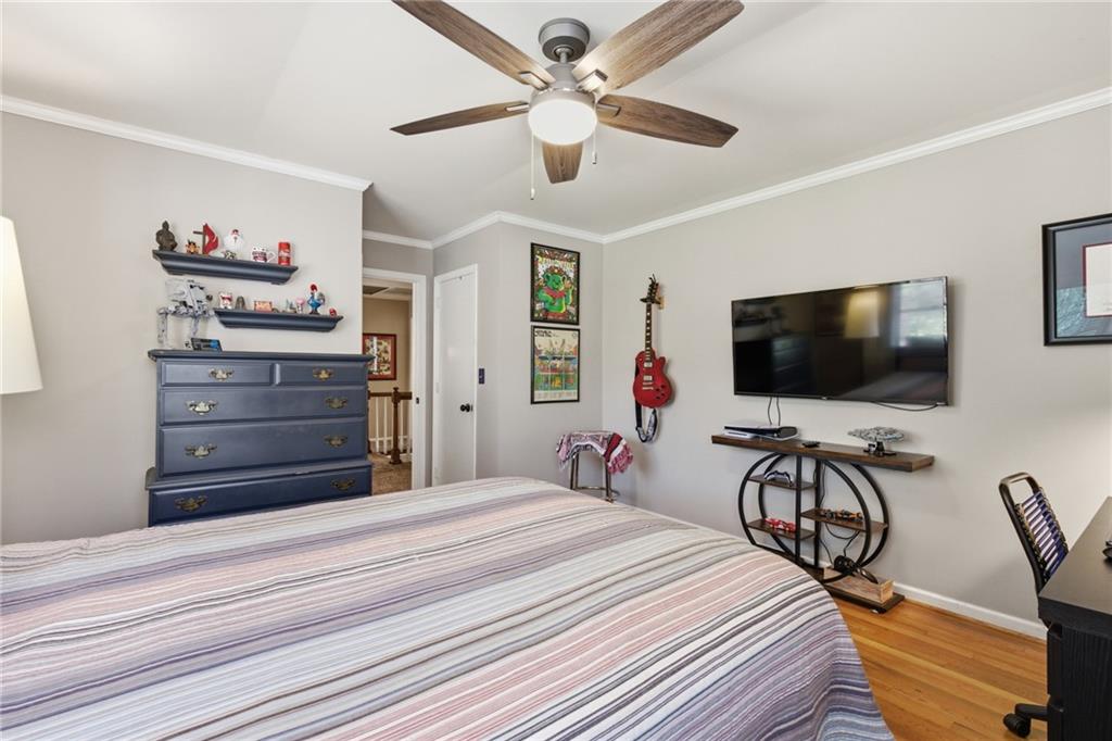 1924 Queens Way Atlanta, GA 30341 - Photo 55 of 88 a bedroom with a bed and a flat screen tv