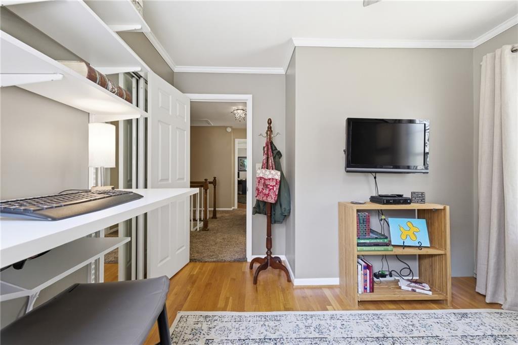 1924 Queens Way Atlanta, GA 30341 - Photo 58 of 88 a living room with furniture and a flat screen tv